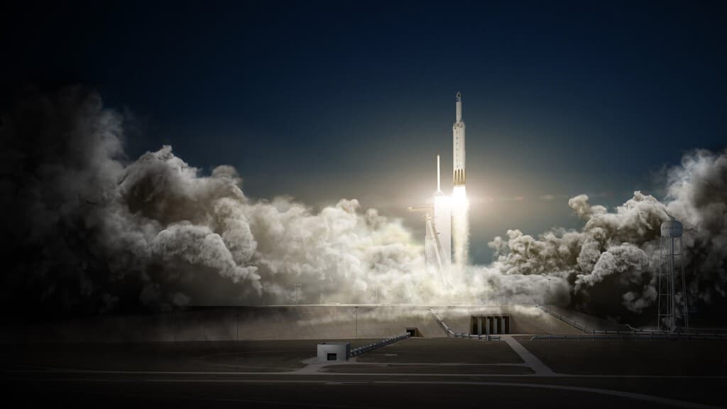 Tres cohetes Falcon Heavy y Falcon 9 en proceso de lanzamiento en diferentes plataformas espaciales